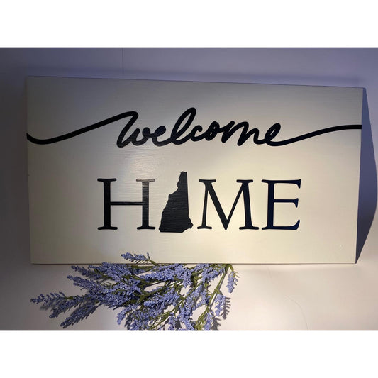 Welcome Home N.H hanging sign